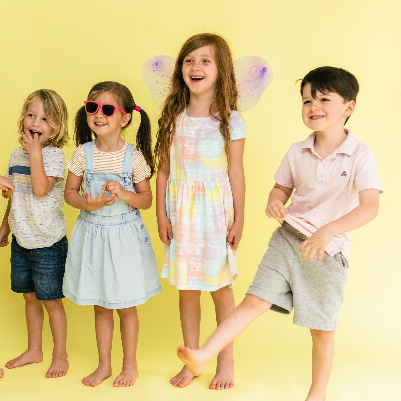 happy children enjoying thrifted outfits 